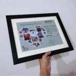 Close-up shot focusing on the heart-shaped photo collage grid containing miniature baby pictures and red heart graphics.