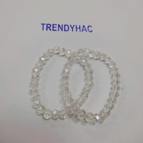 Full view of two interlocking clear faceted crystal beaded bracelets under a Trendyhac sign.