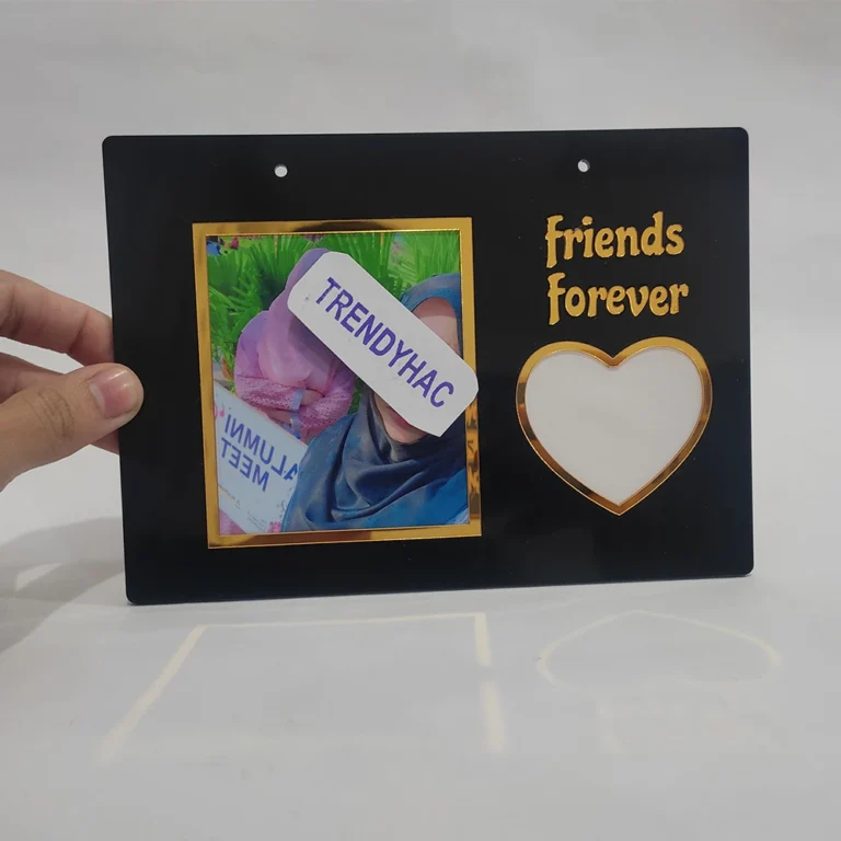 Black acrylic thumb board book page holder featuring a custom photo of two friends and the text Friends Forever.