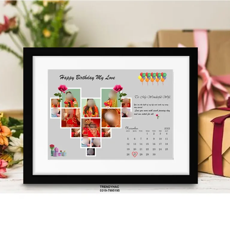 Front view of a black framed photo collage with a heart-shaped picture grid and a November calendar page on a grey background.