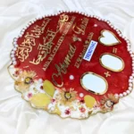 Lower section view of the Nikah board showing two oval signature boxes, a plus sign, and a gold-bordered heart.