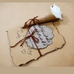 Presentation of the textured aged parchment paper and elegant cursive script text on the love letter.