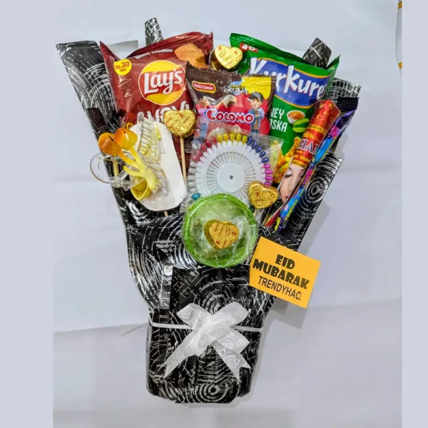 Snack bouquet with chips, chocolate, hair clip, and mehndi wrapped in black paper with an Eid Mubarak tag.