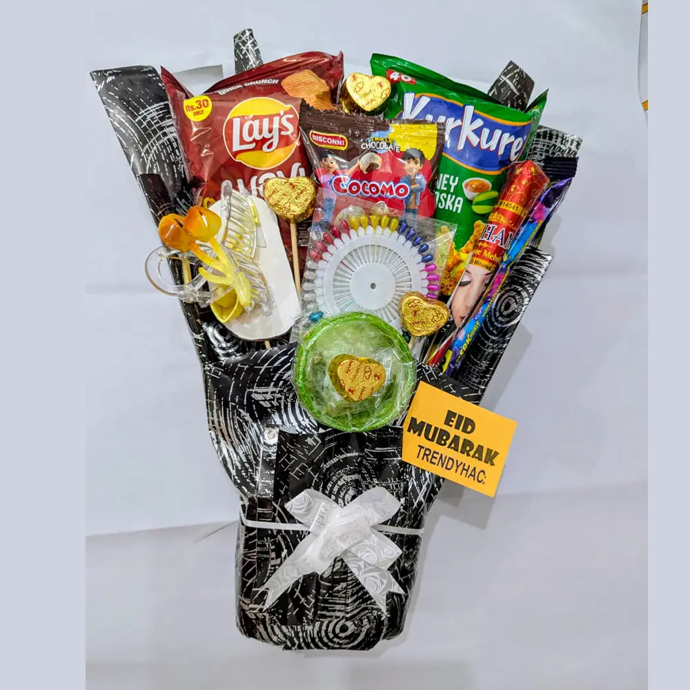 Snack bouquet with chips, chocolate, hair clip, and mehndi wrapped in black paper with an Eid Mubarak tag.