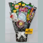 Close-up view of Lay's chips, Kurkure, and heart-shaped chocolates arranged inside a gift bouquet.